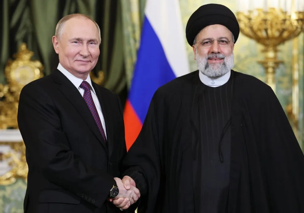 El presidente ruso, Vladímir Putin, y el fallecido presidente iraní, Ebrahim Raisí. Fotos: EFE