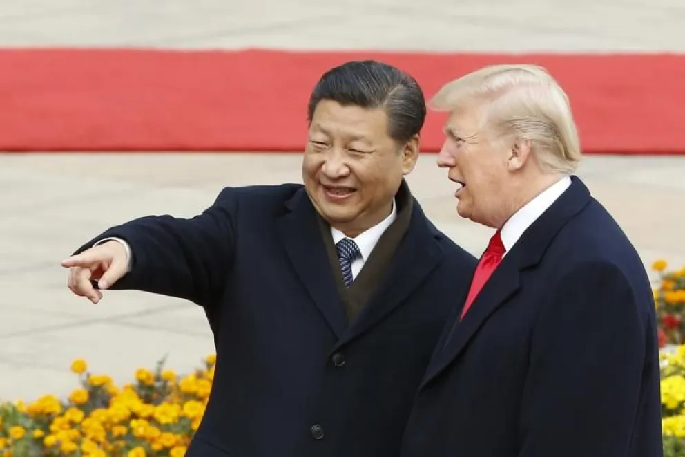 El presidente chino, Xi Jinping con Donald Trump en una imagen de archivo. Foto: Pool / Huffington Post