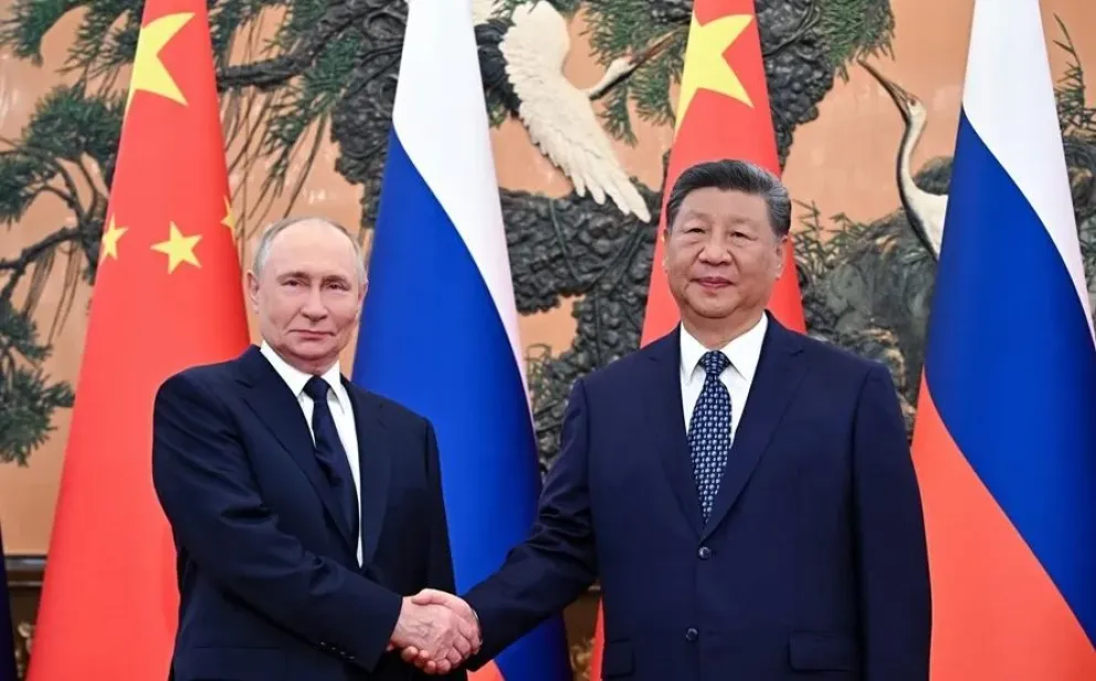 Vladimir Putin y Xi Jinping en una reunión previa al desfile en la capital de China. Foto: EFE