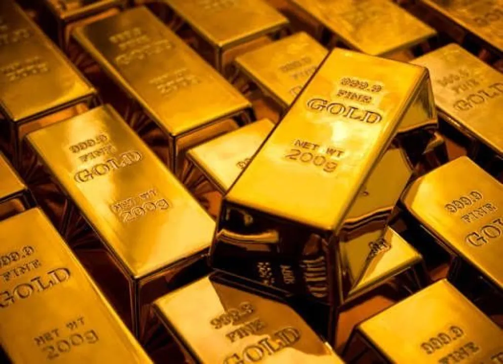 Una imagen referencial de lingotes de oro generada con Canva. 
