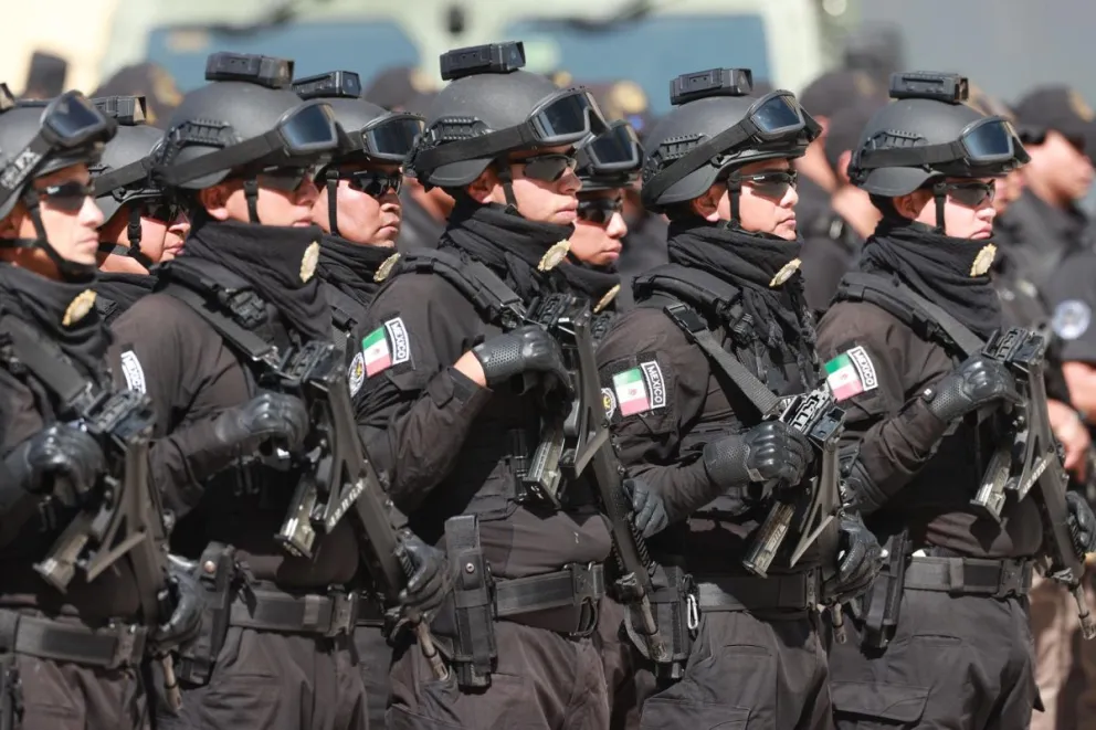 Integrantes de la Secretaria de Seguridad y Protección Ciudadana (SSPC), forman durante un acto protocolario este martes en la Ciudad de México (México). EFE